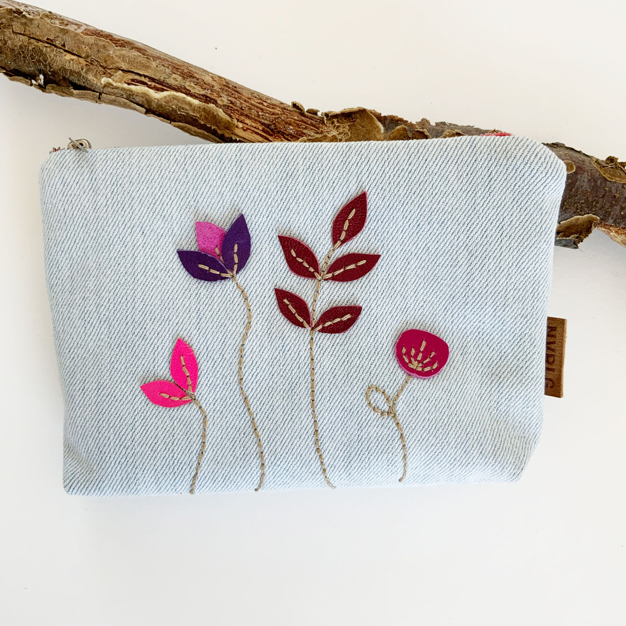 NVRLG-handmade-light-blue-upcycled-denim-small-pouch-pink-magenta-purple-flower-hand-embroidery-floral-leather-applique